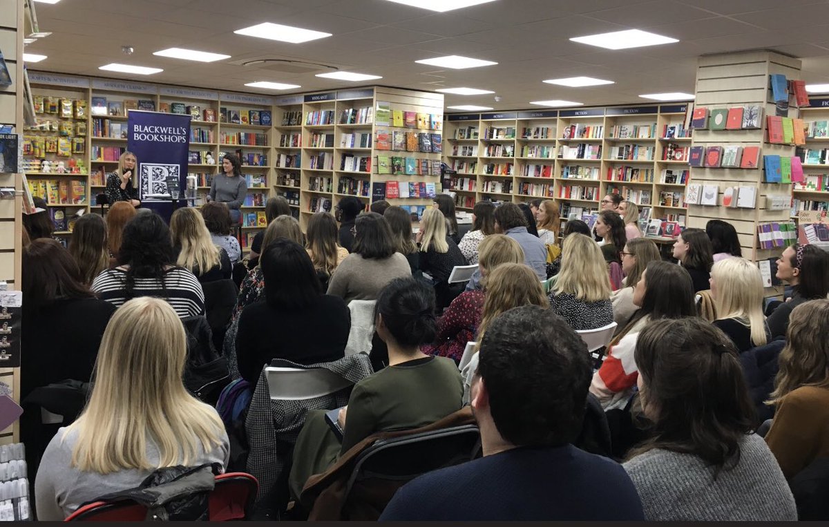 An audience watching an event at Blackwell's Bookshop at University Green on Oxford Road