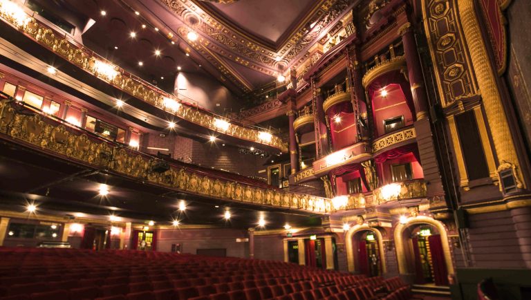 Internal image of Palace Theatre Manchester with lights on