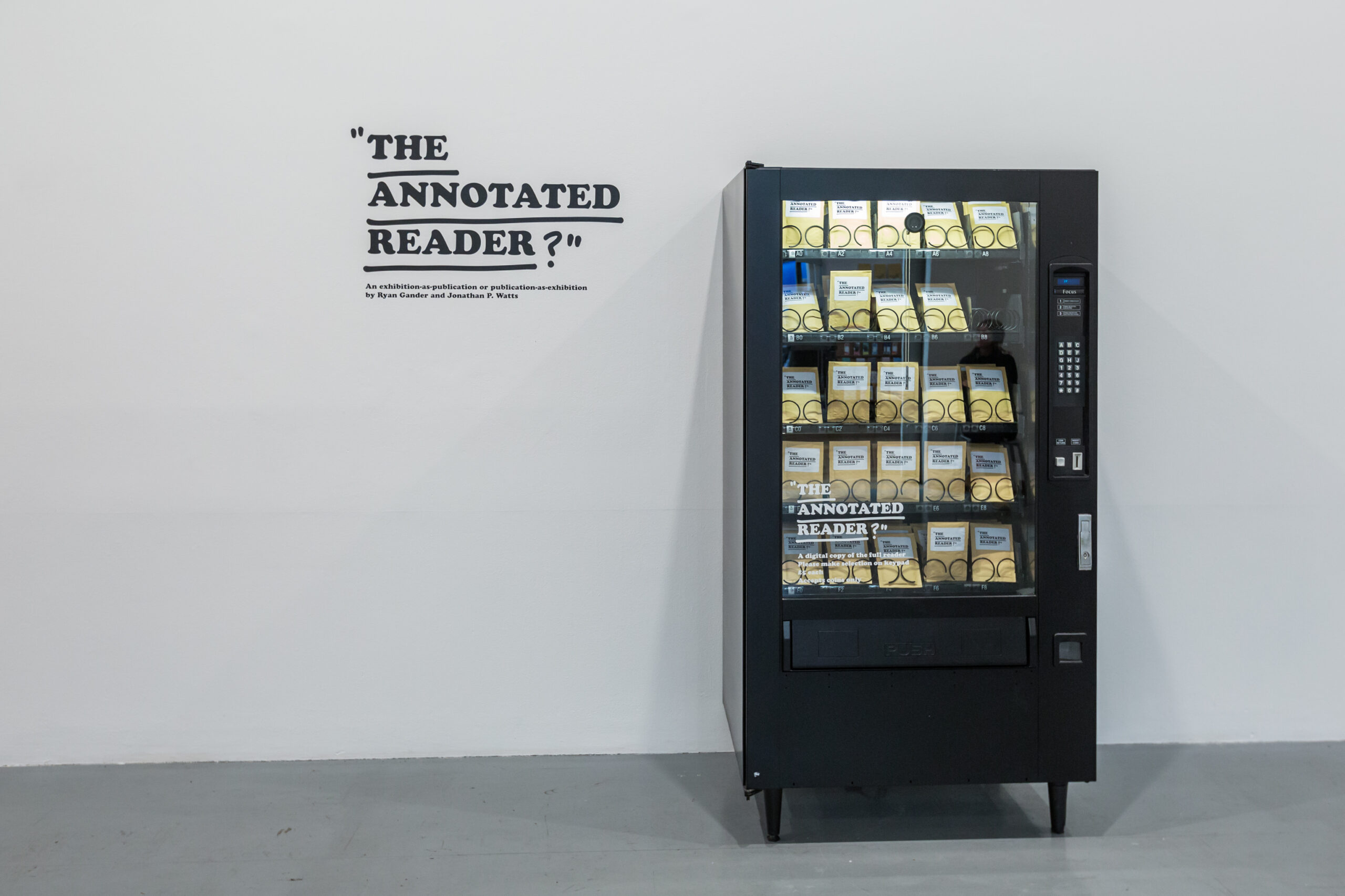 An image of a vending machine filled with books which is The Annotated Reader