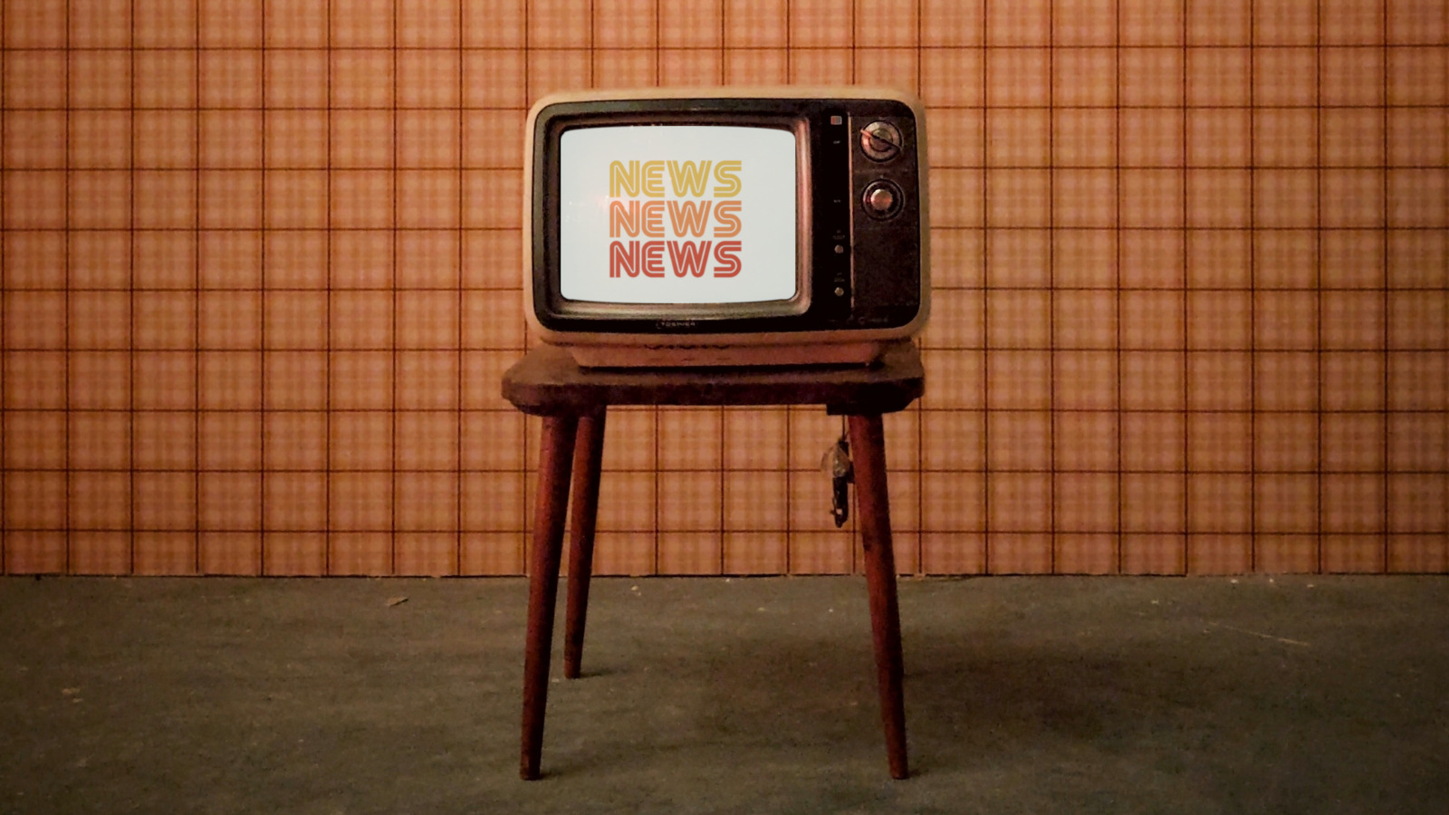 A television with the words news news news displayed on it