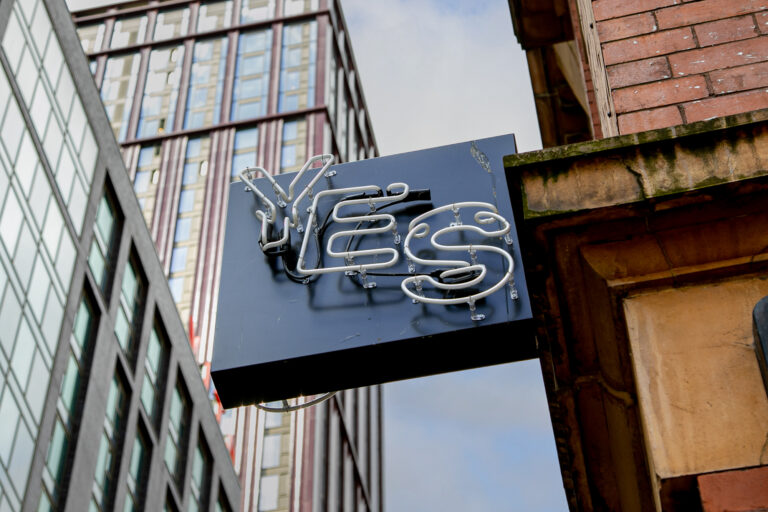 Image of sign outside of YES, one of the many student pubs and bars on oxford road