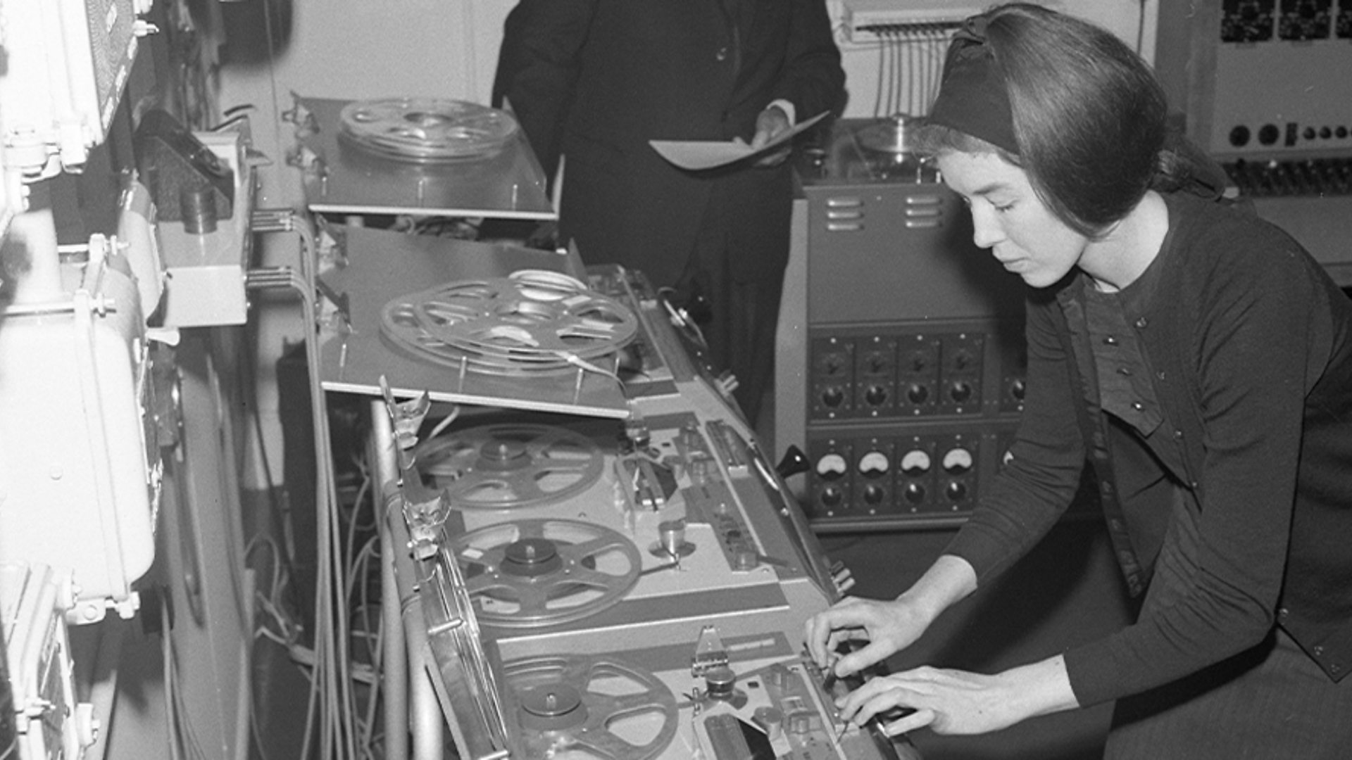 Image: Delia Derbyshire composes using multiple reel-to-reel tape machines in June 1965.
